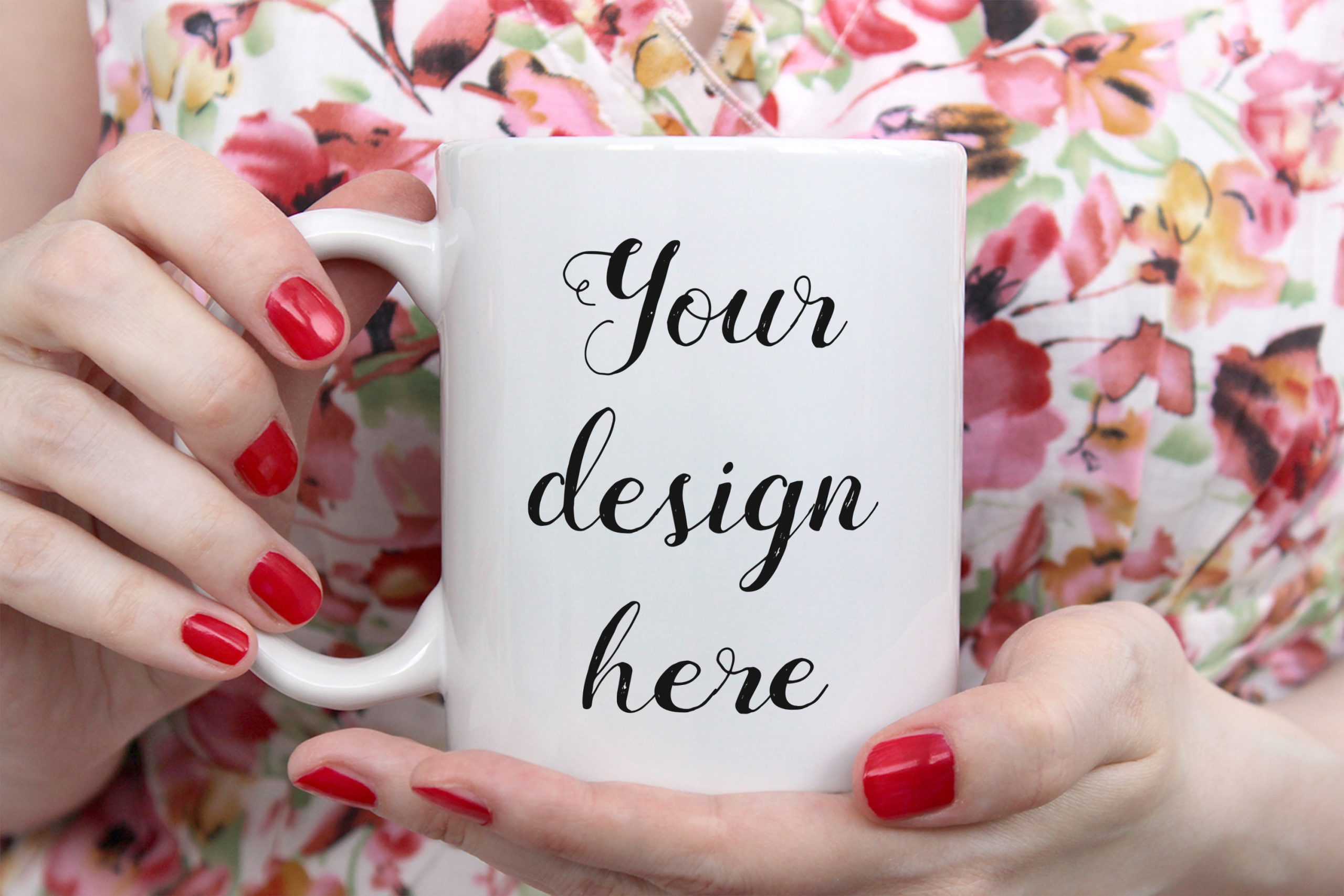 Girl is holding white cup, mug in hands. Mockup for designs.